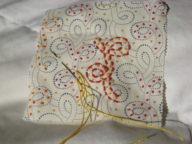 on the left, the beginning of Whipped Running Stitch, a.k.a. cordonnet stitch); base stitches are yellow