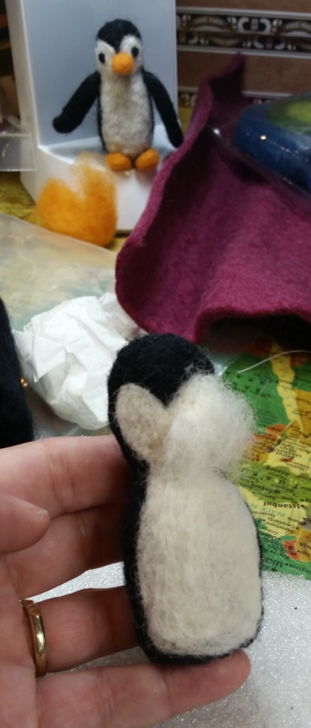 Magically (after much hand-punching) that black roll of roving turns into penguin base - ready for his mask and tummy cover.